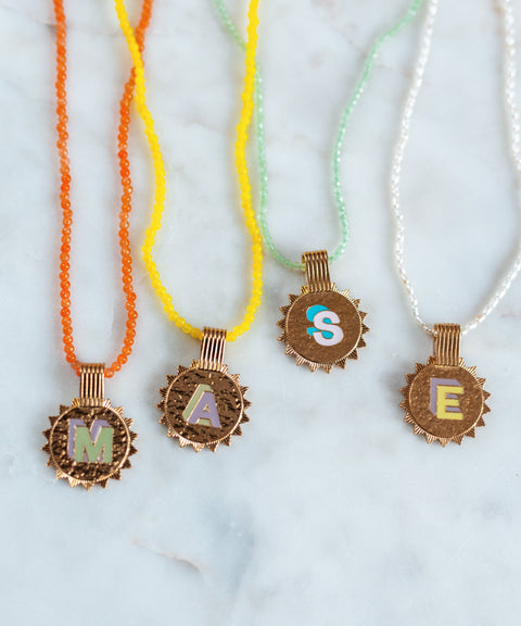 Handmade Say My Name Mint necklaces with letter medaillons by WALD Berlin.
