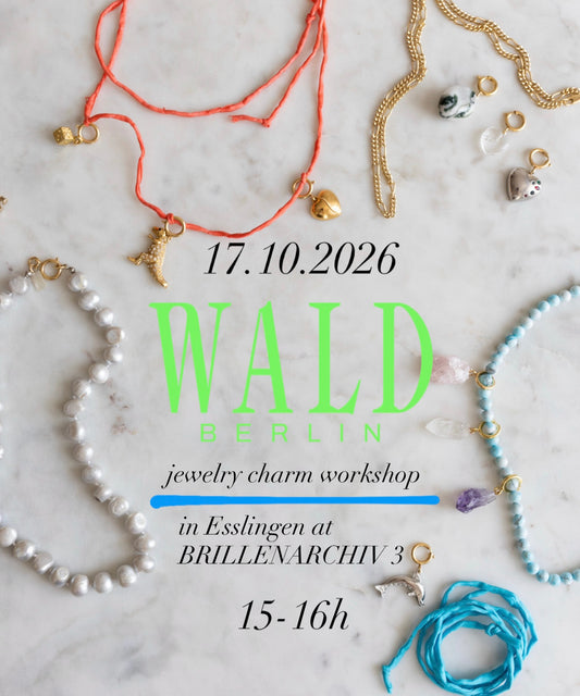 Assorted necklaces, bracelets, and charms from WALD Berlin are displayed on a white surface, accompanied by event details for the DIY Charm Jewelry Workshop in Esslingen on October 17, 2026.