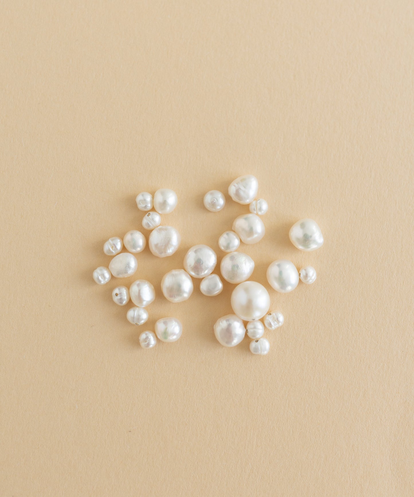 A charm-filled kit of Sweet Water Pearls from WALD World showcased on a beige background.