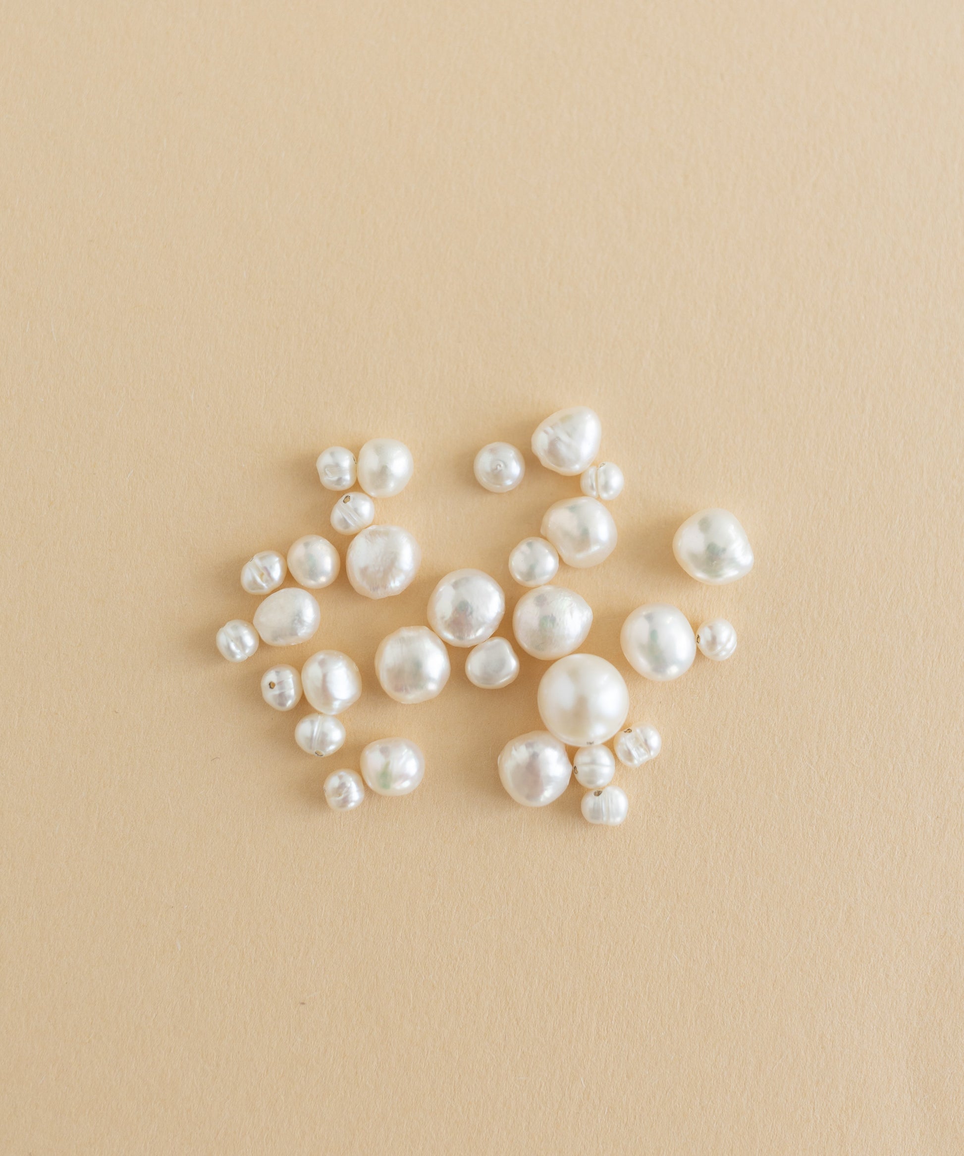 A charm-filled kit of Sweet Water Pearls from WALD World showcased on a beige background.