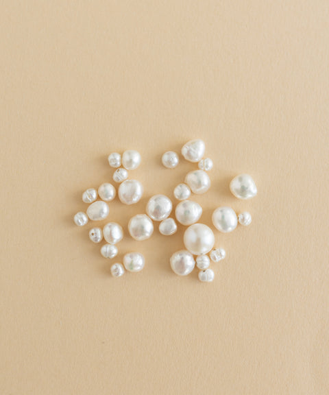 A charm-filled kit of Sweet Water Pearls from WALD World showcased on a beige background.