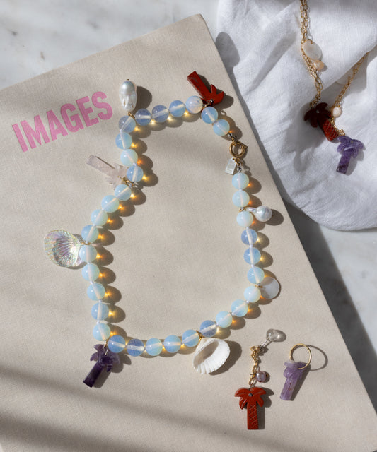 Mexicana Mariachi Earrings Pearl by WALD Berlin—handmade in Germany—displayed on a book titled "IMAGES.
