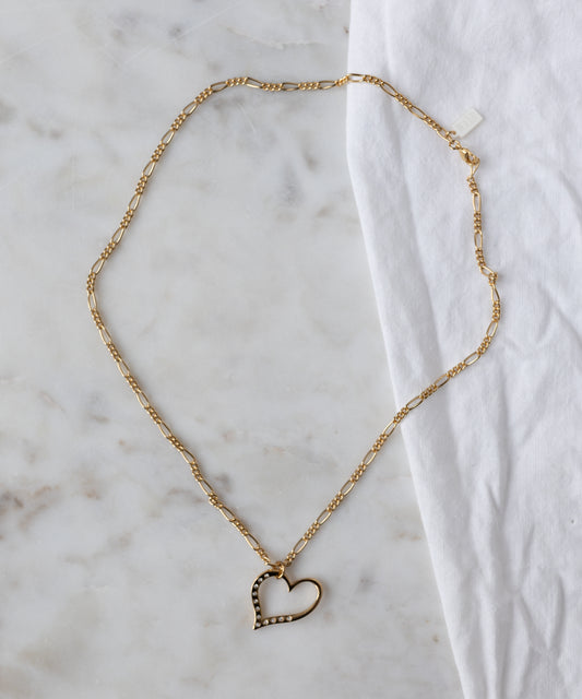 The WALD Berlin Valentine’s Day special sketch heart necklace features a goldplated brass pendant with sparkling Swarovski stones on a delicate chain.