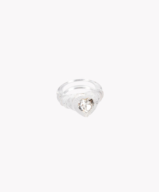 The WALD Berlin Lover Transparent Ring showcases a large, heart-shaped Swarovski stone at its center, presented on a plain white background.