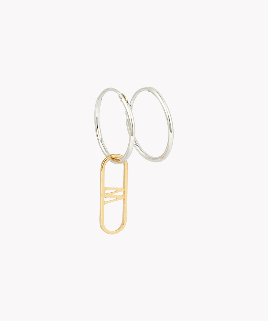 The SAMPLE SALE NYC Cream Earrings by WALD Berlin feature two sterling silver hoops connected by a handmade gold oval charm.