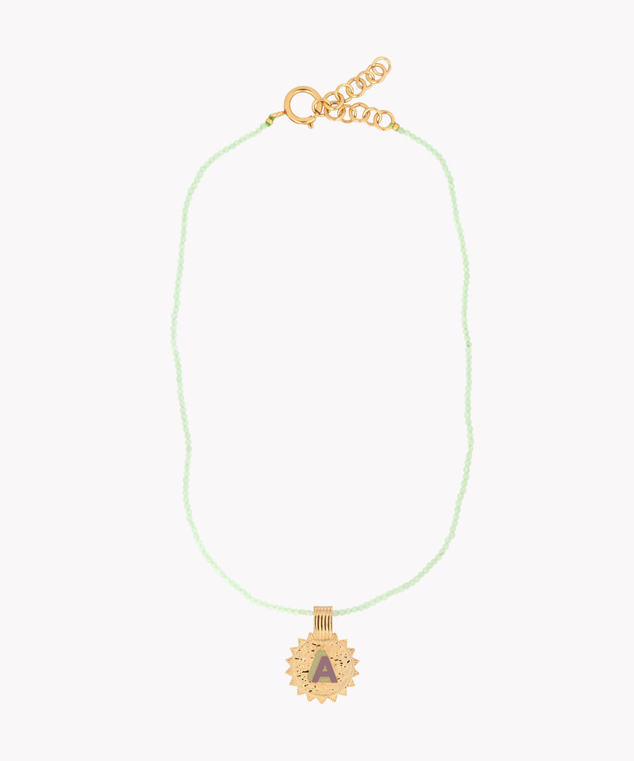 A WALD Berlin Say My Name Mint Necklace with a gold sun charm.