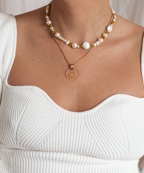 A woman wearing a WALD Berlin Smilie Dude Pearl Necklace in Germany's capital city.