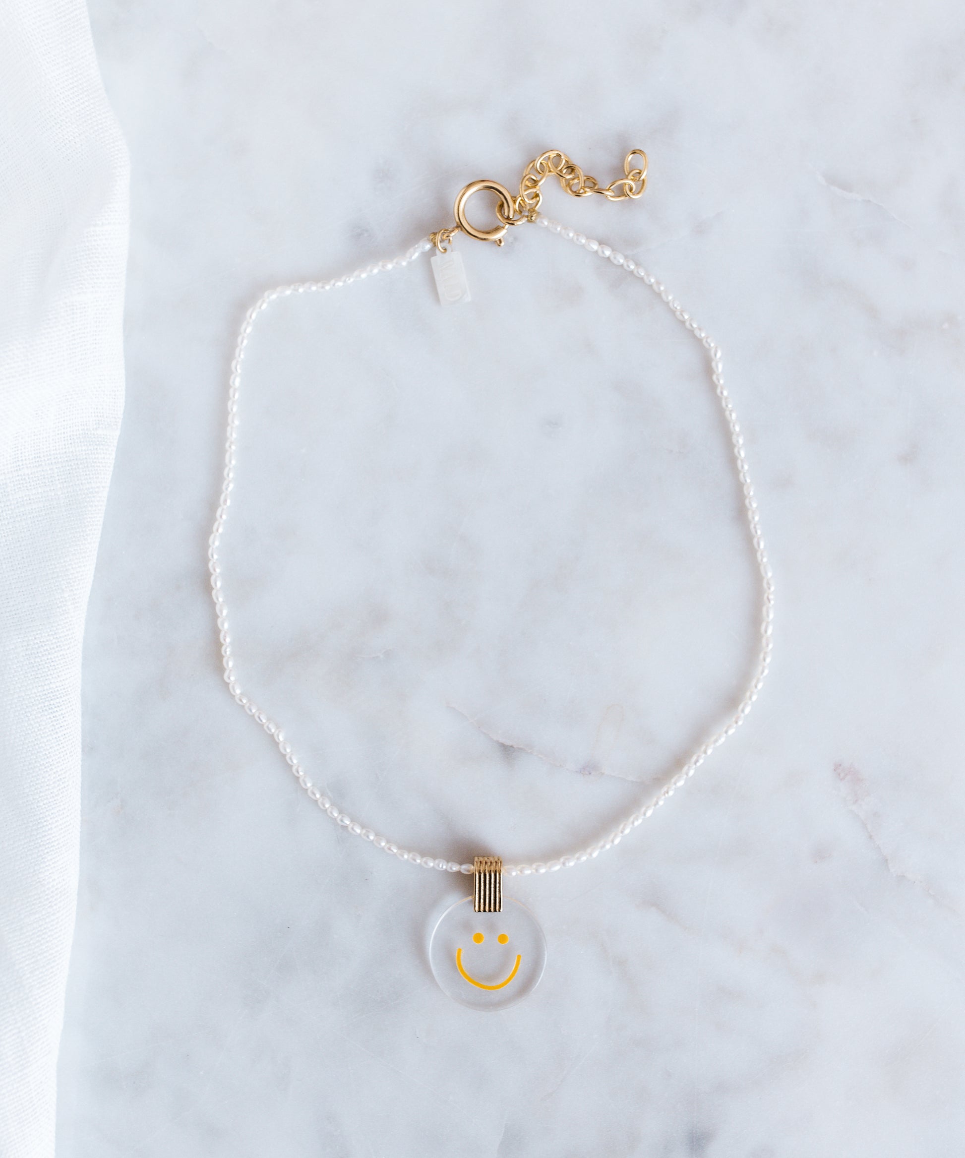 A Smilie Dude Pearl Medaillon Necklace from WALD Berlin, Germany's jewelry brand.